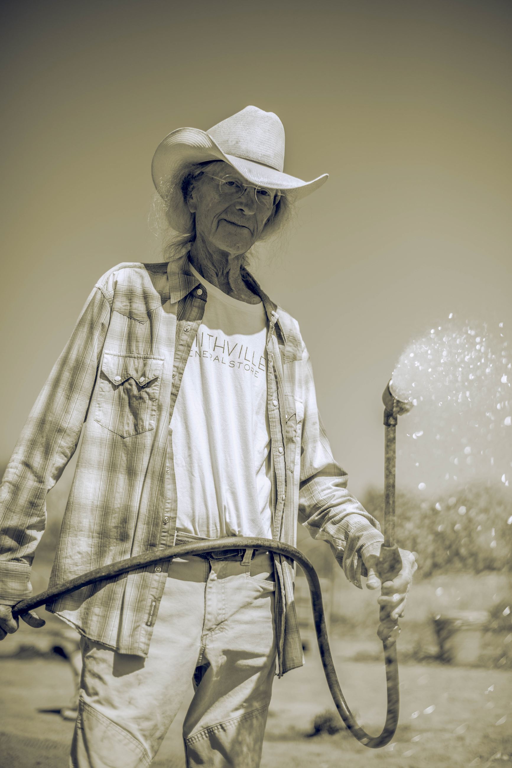 Jim Horton While Watering, he is the Community Garden Director